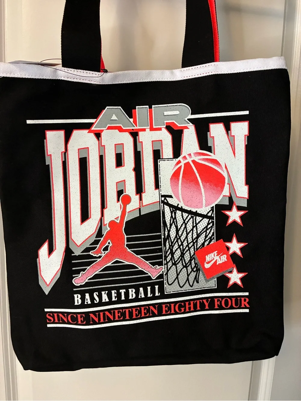 New Jordan Brand Jam 84 Tote bag in black and infrared